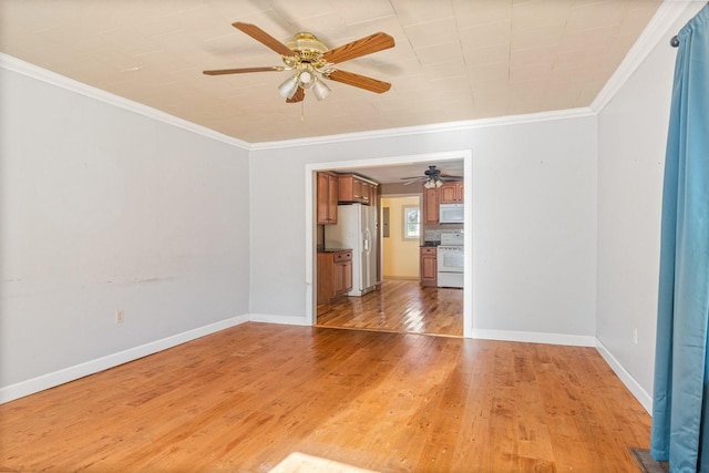 unfurnished living room with light hardwood / wood-style flooring and crown molding