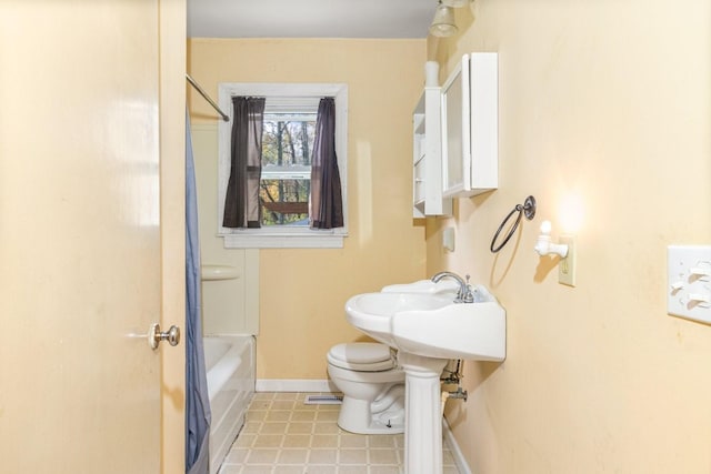 full bathroom with toilet, washtub / shower combination, and sink