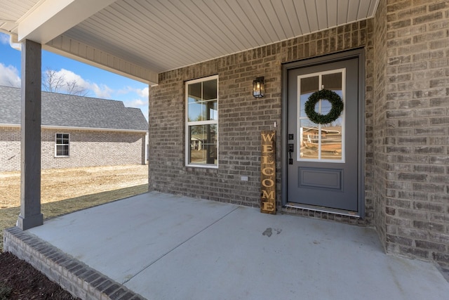 property entrance featuring covered porch