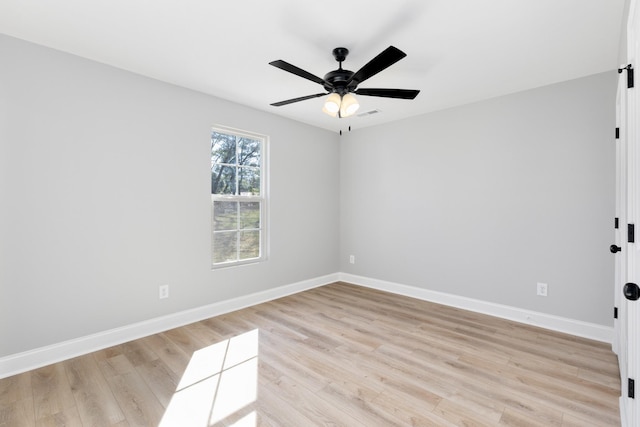 spare room featuring ceiling fan and light hardwood / wood-style flooring