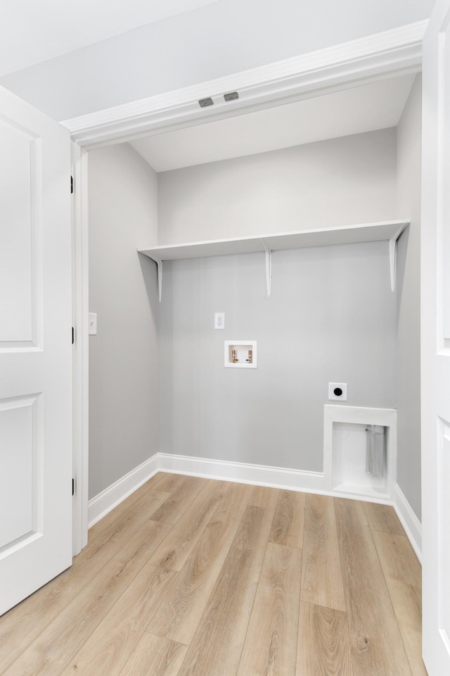 clothes washing area with washer hookup, light hardwood / wood-style floors, and electric dryer hookup