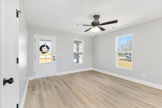 entryway with ceiling fan and light hardwood / wood-style flooring