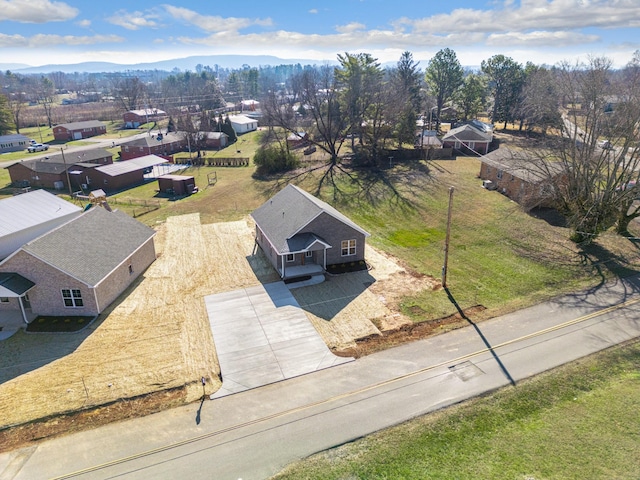 birds eye view of property featuring a mountain view