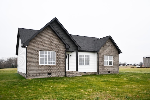 rear view of house with a yard