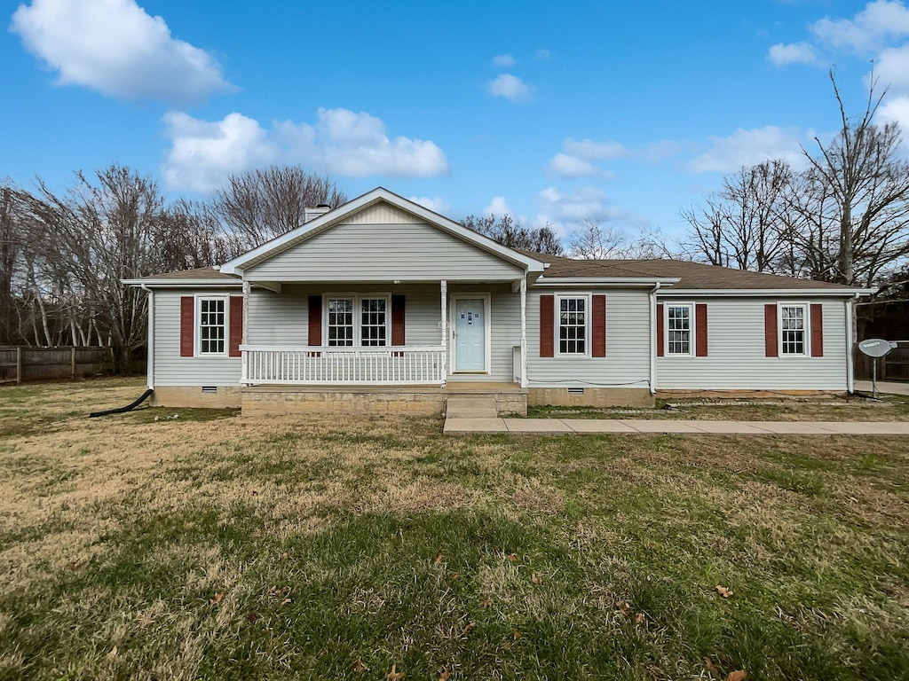 ranch-style home featuring a front yard and a porch