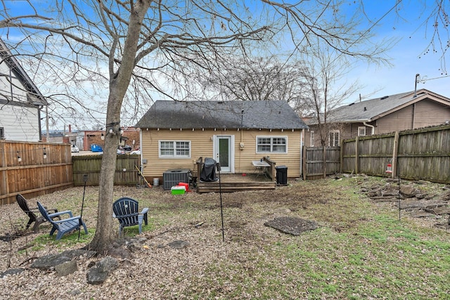 back of house featuring central AC unit