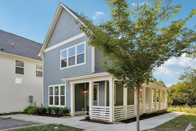 view of front of home featuring a sunroom