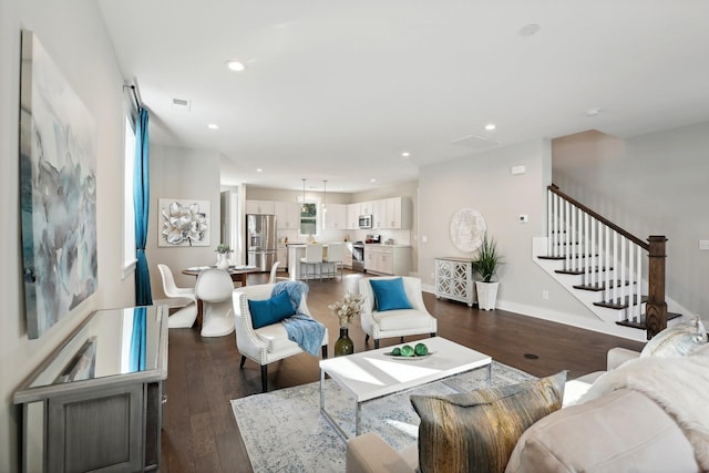 living room featuring dark hardwood / wood-style flooring