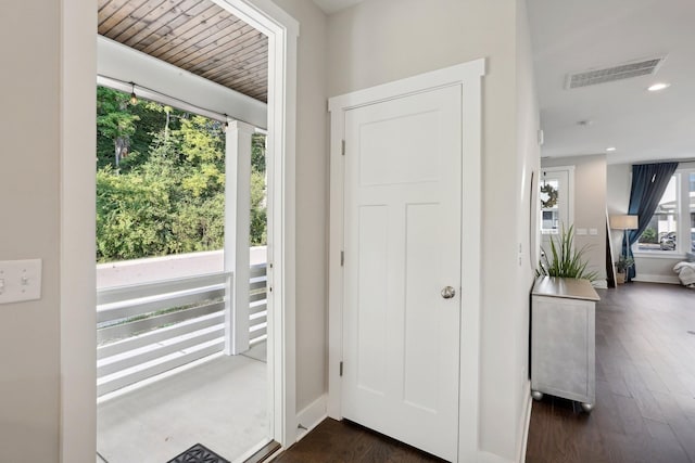 doorway to outside with dark hardwood / wood-style flooring