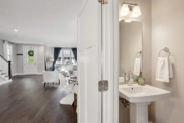 bathroom featuring wood-type flooring and sink