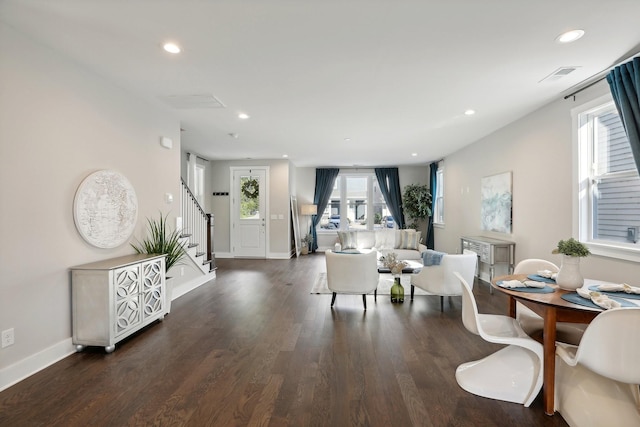 living room with dark hardwood / wood-style flooring