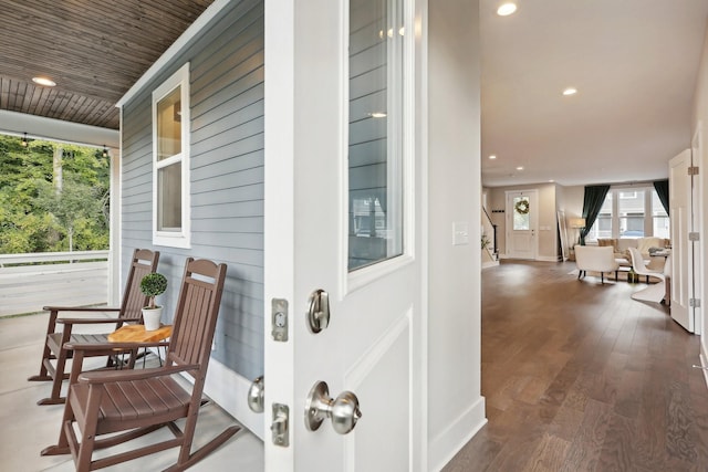 doorway to property featuring a porch