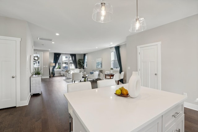 dining space featuring dark hardwood / wood-style floors