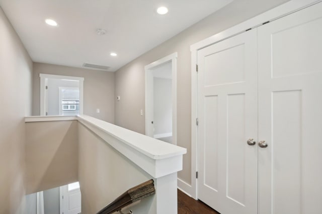 corridor featuring dark hardwood / wood-style flooring