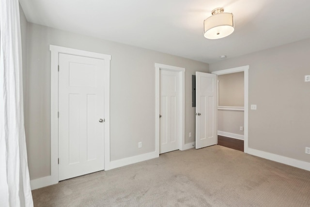 unfurnished bedroom with light carpet