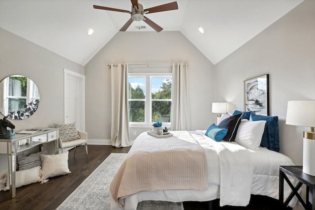 bedroom with ceiling fan, dark wood-type flooring, and lofted ceiling