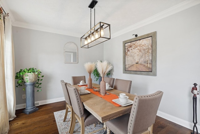 dining area featuring dark hardwood / wood-style floors and crown molding