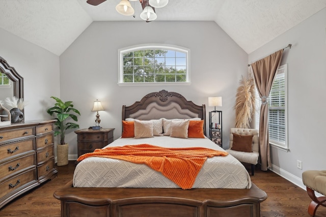 bedroom with lofted ceiling, ceiling fan, and a textured ceiling