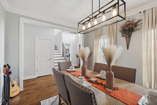 dining room featuring a textured ceiling, dark hardwood / wood-style flooring, and ornamental molding