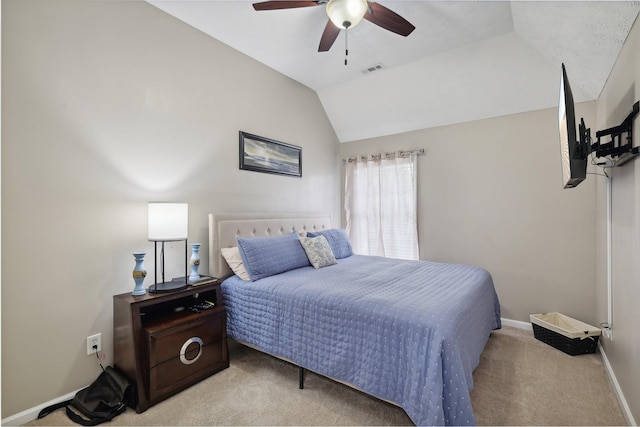 bedroom with ceiling fan, light colored carpet, and lofted ceiling