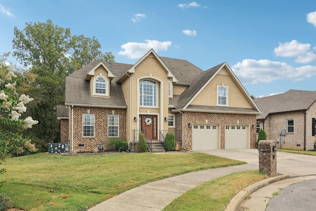 view of front of home featuring a front yard and a garage