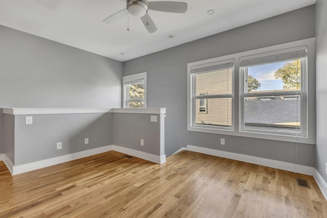 unfurnished room with light hardwood / wood-style floors and ceiling fan