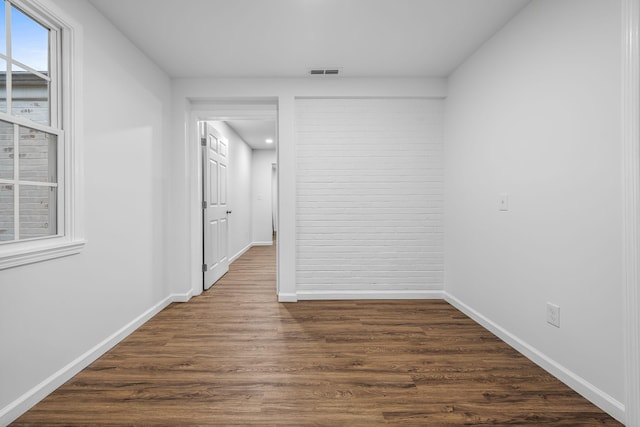 hallway featuring dark wood-type flooring