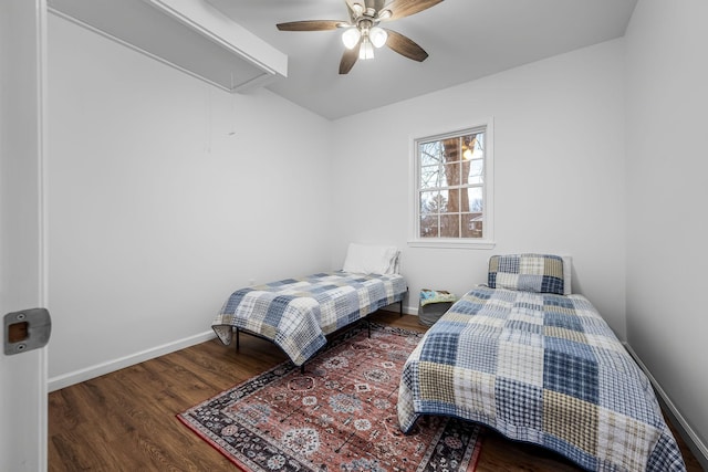 bedroom with ceiling fan and dark hardwood / wood-style floors