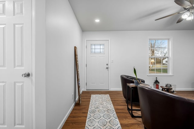 foyer featuring dark wood-type flooring and ceiling fan