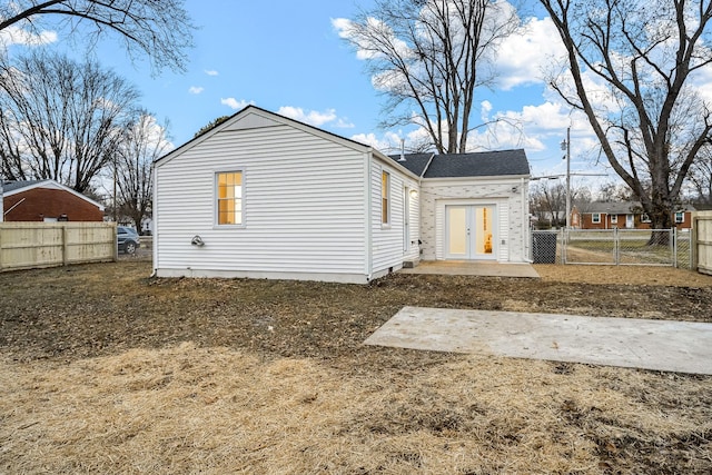 rear view of house with french doors and a patio