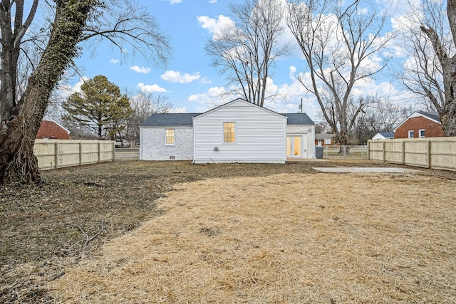 rear view of house with a lawn