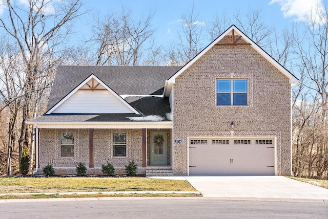 view of front of property with a front lawn and a garage