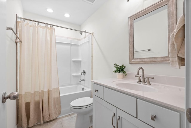 full bathroom featuring shower / bathtub combination with curtain, vanity, tile patterned flooring, and toilet