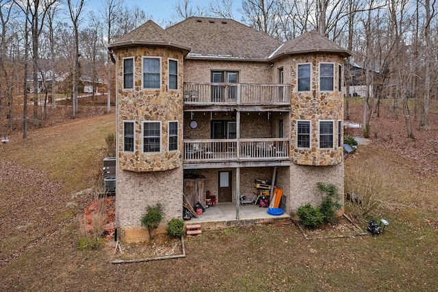 back of house featuring a patio and a balcony