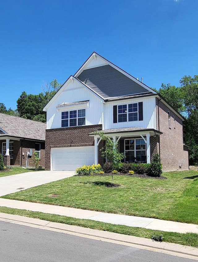 view of front of home featuring a garage and a front yard