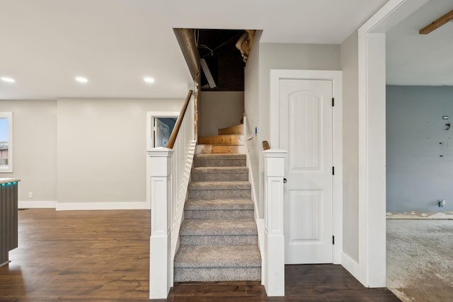 staircase featuring hardwood / wood-style floors