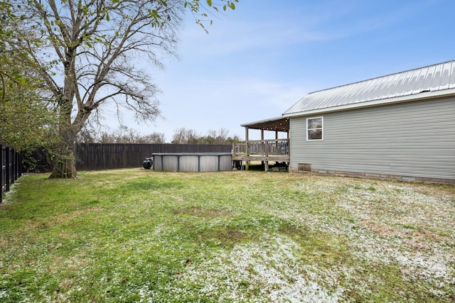 view of yard with a pool side deck