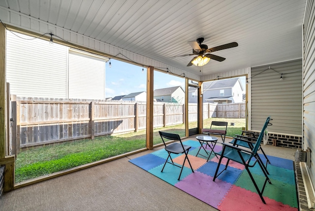 sunroom / solarium with ceiling fan