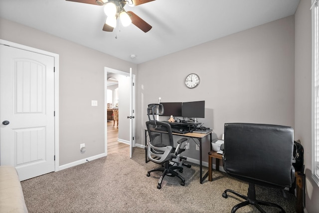 carpeted office with ceiling fan