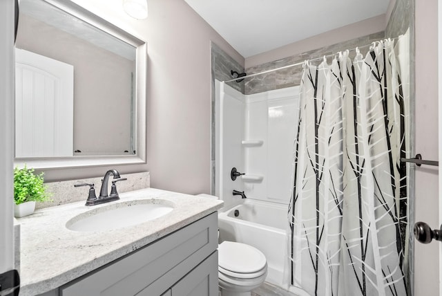 full bathroom with vanity, toilet, and shower / bath combo with shower curtain