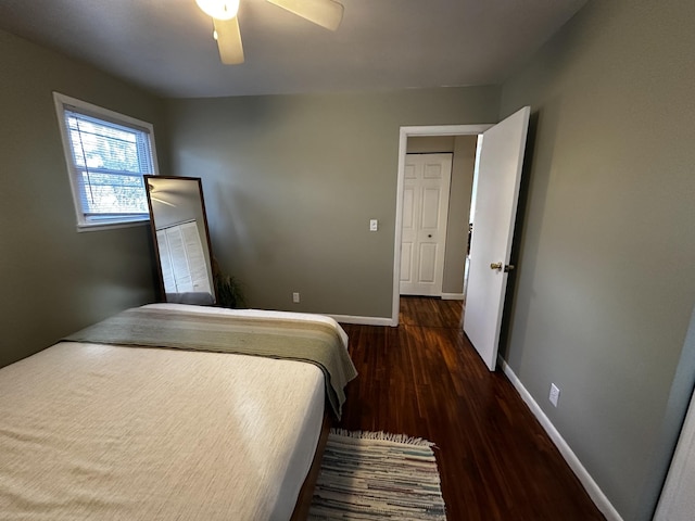 bedroom featuring ceiling fan and dark hardwood / wood-style flooring