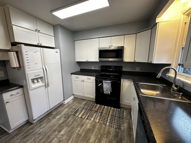 kitchen featuring sink, white refrigerator with ice dispenser, white cabinets, dark hardwood / wood-style floors, and black electric range oven