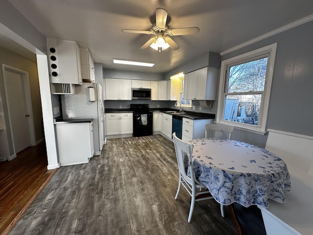 kitchen featuring white cabinetry, sink, black electric range, dark hardwood / wood-style floors, and dishwashing machine