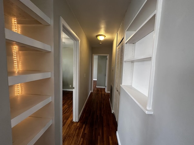 hallway featuring dark hardwood / wood-style flooring