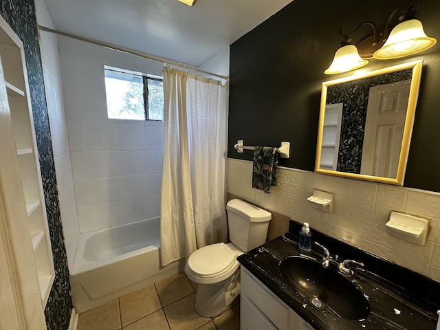 full bathroom featuring vanity, tile patterned floors, toilet, tile walls, and shower / tub combo