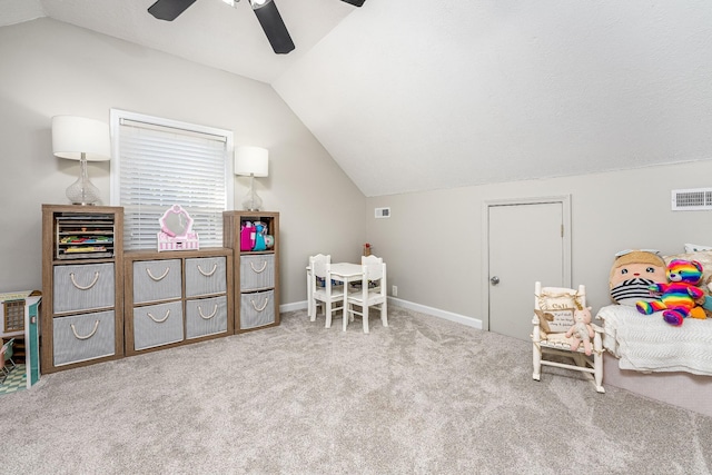 rec room featuring ceiling fan, light colored carpet, and vaulted ceiling