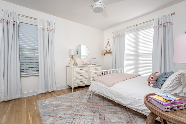 bedroom featuring light hardwood / wood-style floors and ceiling fan