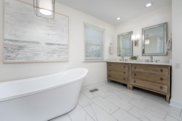 bathroom with vanity and a bathtub