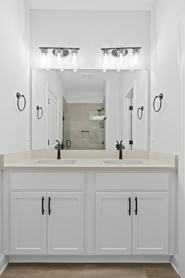 bathroom with vanity and an enclosed shower