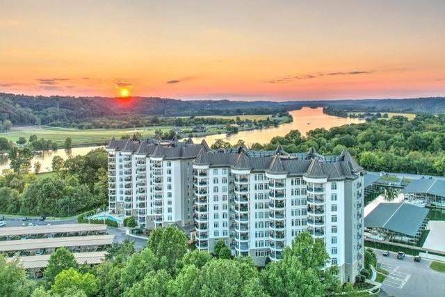 aerial view at dusk with a water view